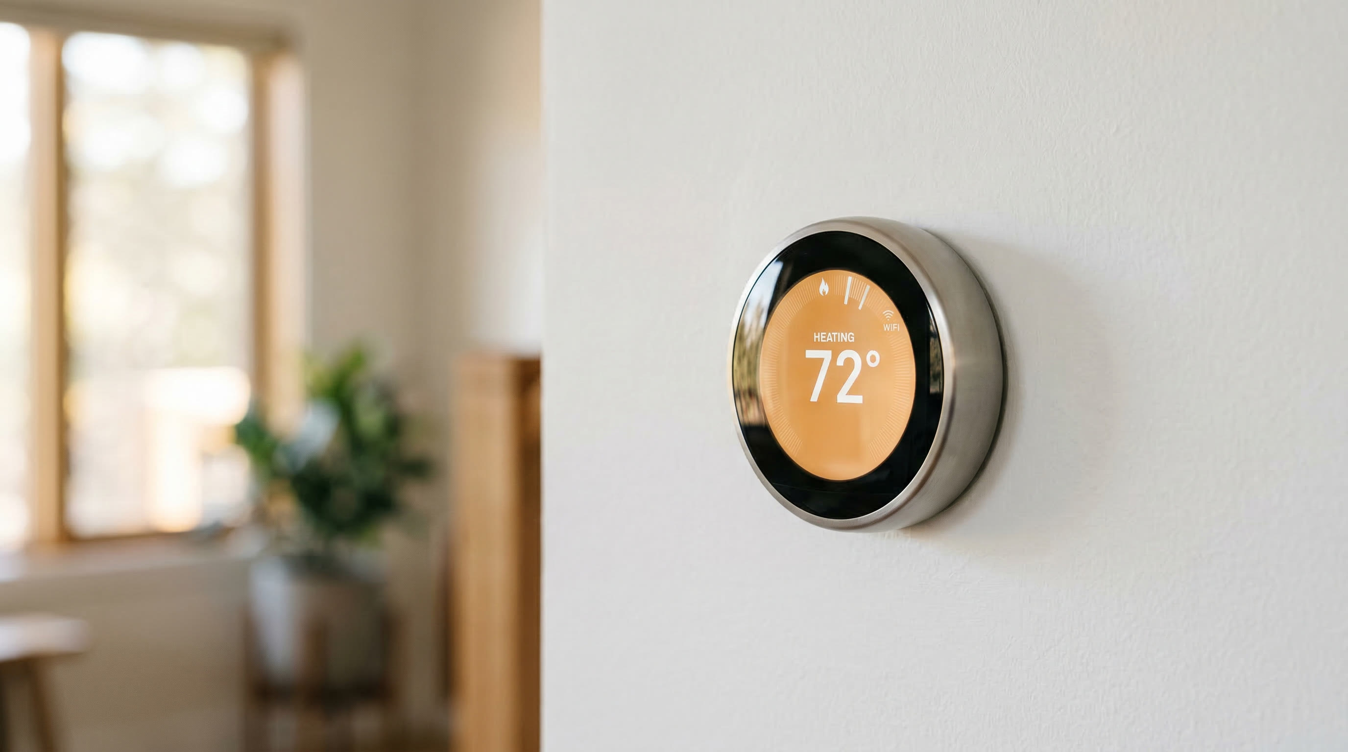 Smart thermostat on white wall